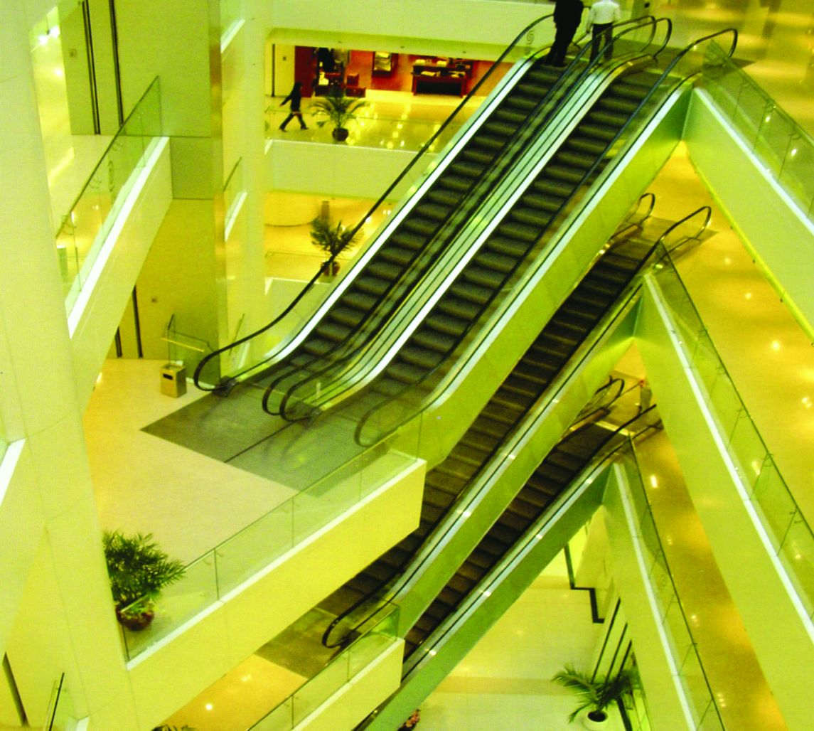 Crossing escalators under warm ambient lighting
