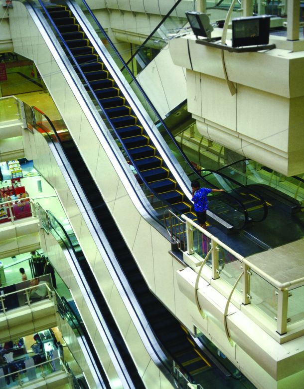 Overhead view of escalator in shopping mall